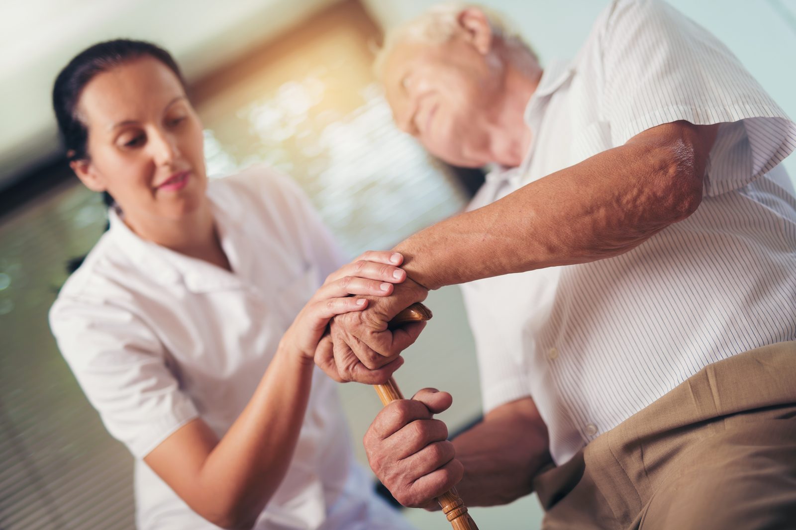 Gentle supportive touch between two people